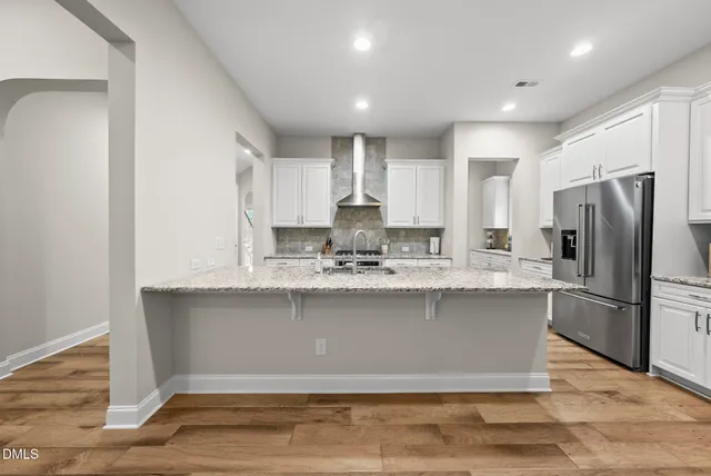 a kitchen with sink and cabinets