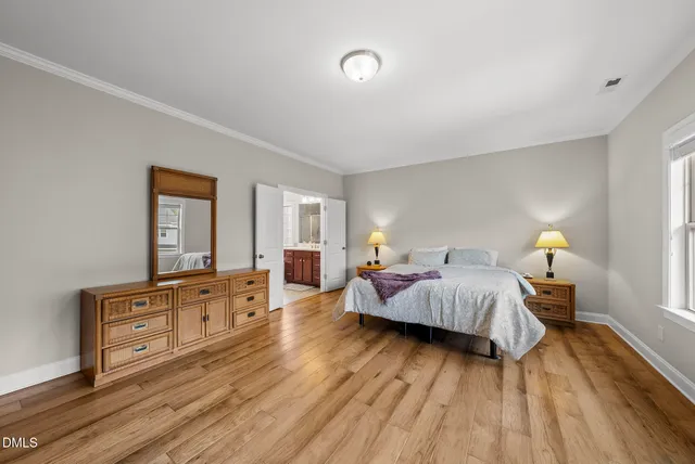 a bathroom with a sink mirror and toilet