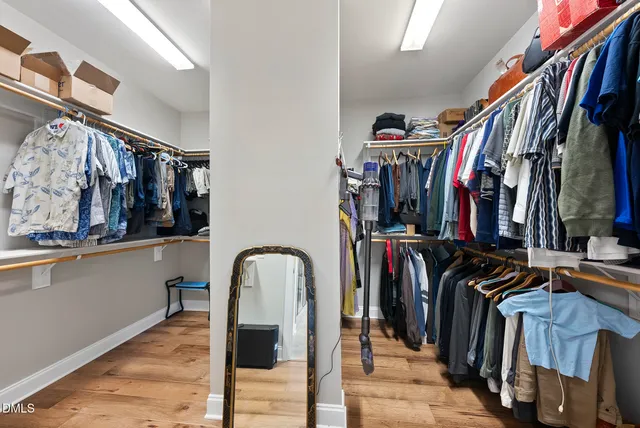 a spacious bathroom with a sink double vanity and a mirror