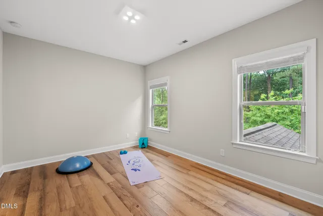 a bathroom with a double vanity sink toilet and shower