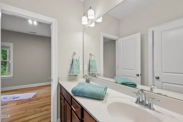 a room with a window and a fan