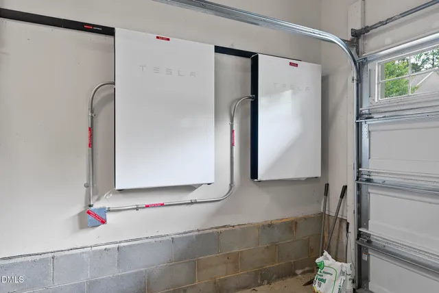 a view of a house with a yard and fence