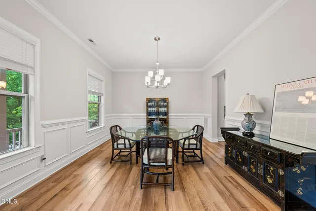 a view of a balcony with wooden floor and fence