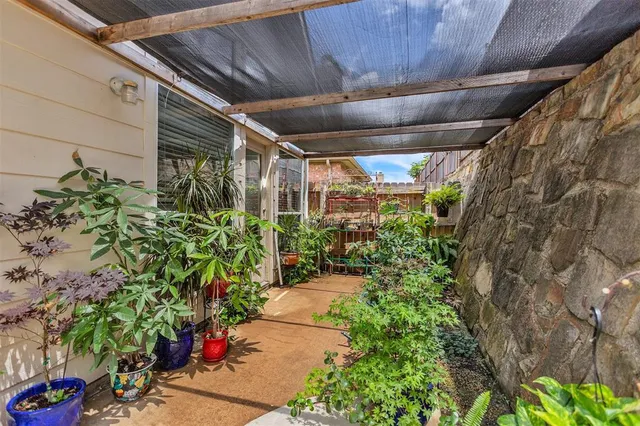 a bedroom with furniture and a wooden floor