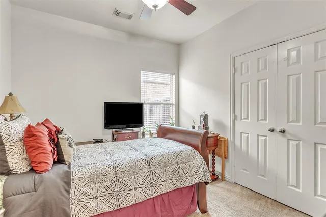 a view of a dining room with furniture a chandelier and wooden floor