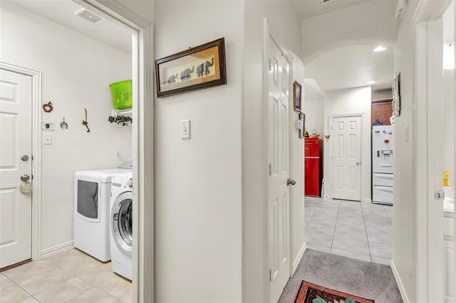 a kitchen that has a lot of cabinets a sink and a wooden floor