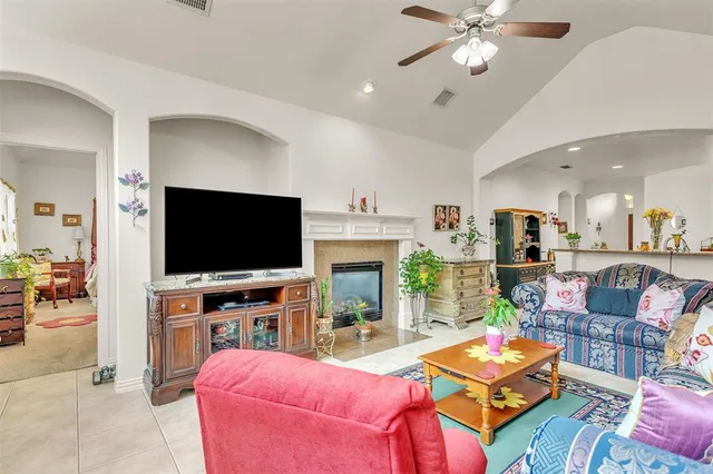 a kitchen with stainless steel appliances granite countertop a stove refrigerator and a sink