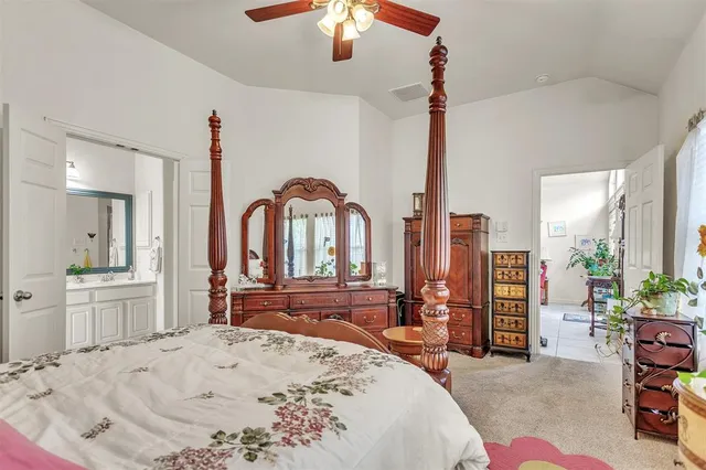 a bathroom with a tub a sink and a window