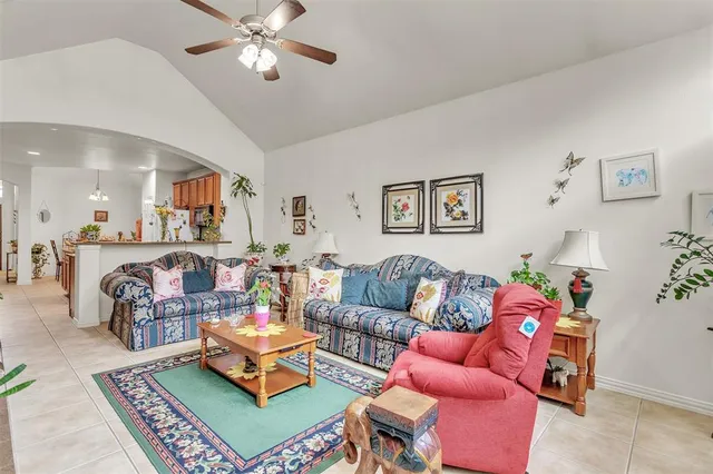 a living room with furniture and a rug