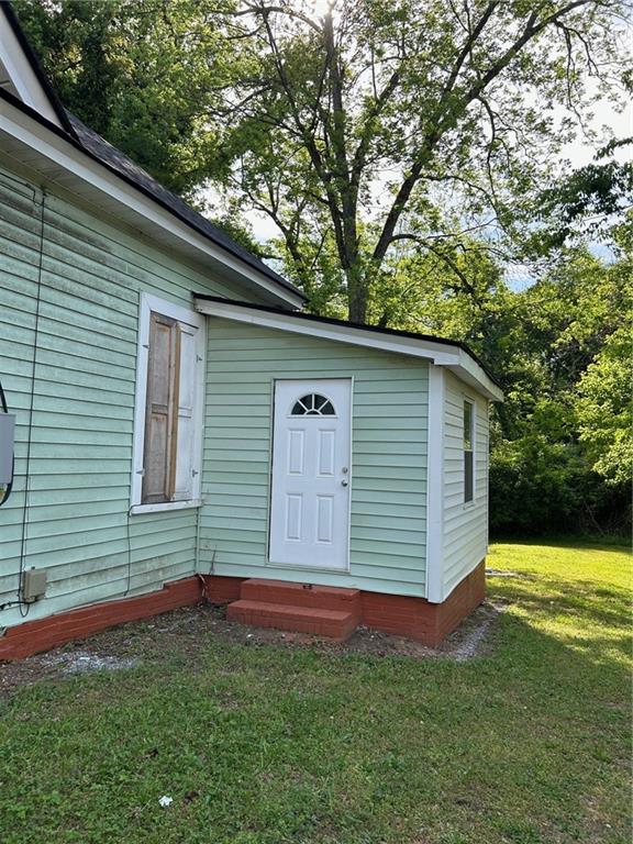 303 Grady Avenue Northeast Rome, GA 30161 - Photo 6 of 9 a front view of a house with a garden