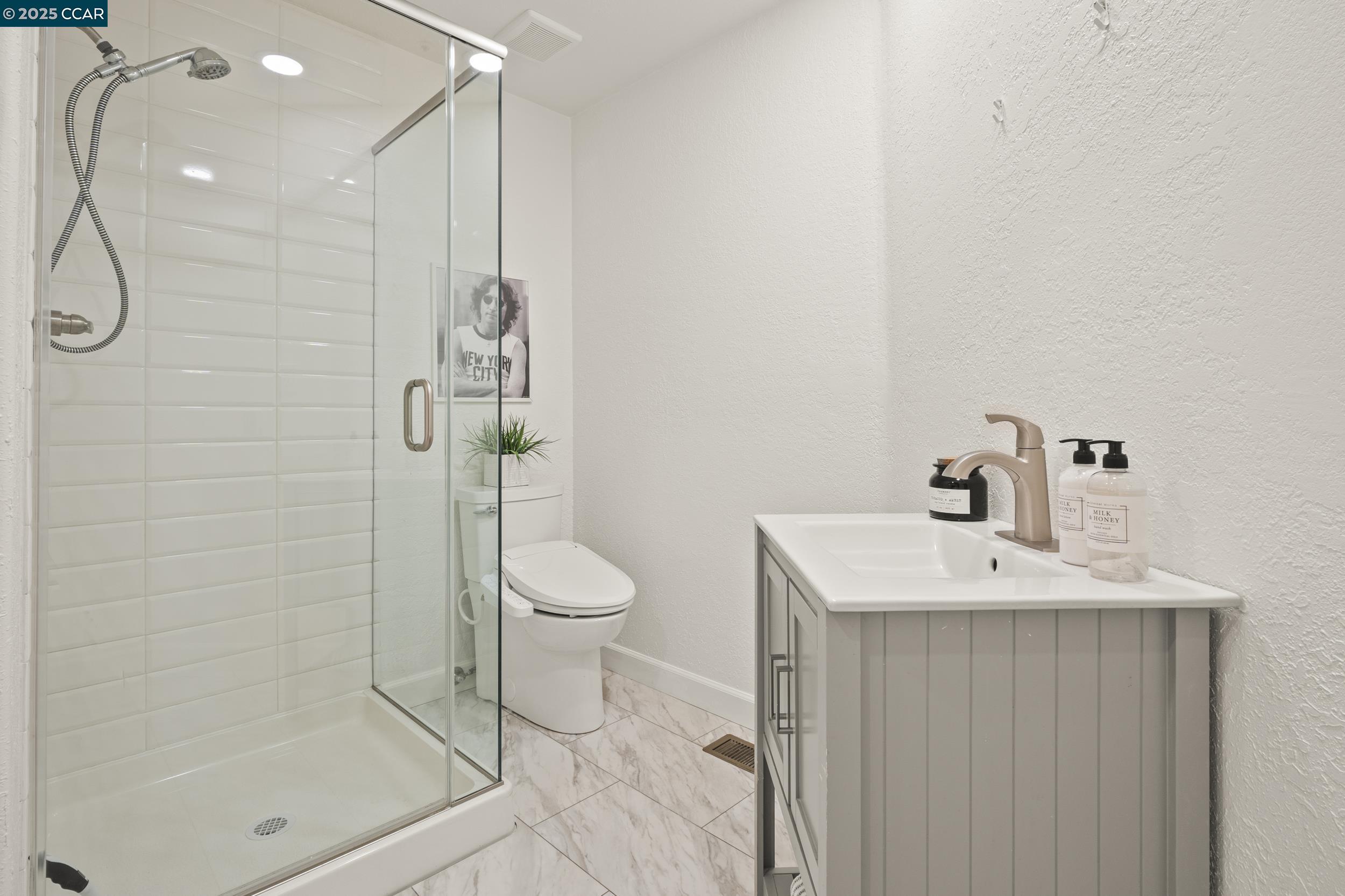 419 Clark Drive Vallejo, CA 94591 - Photo 18 of 39 a bathroom with a sink a toilet and shower