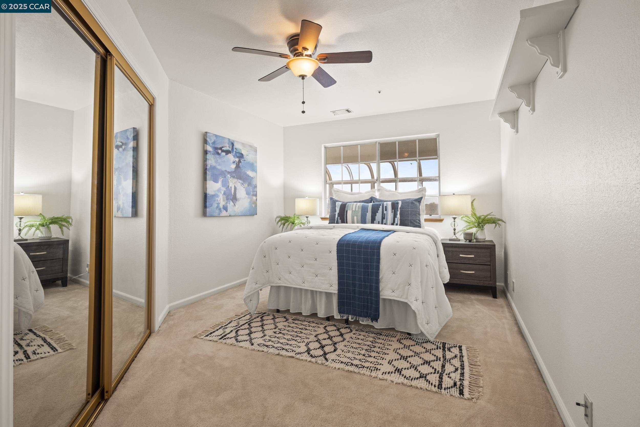 419 Clark Drive Vallejo, CA 94591 - Photo 27 of 39 a bedroom with a bed and a chandelier