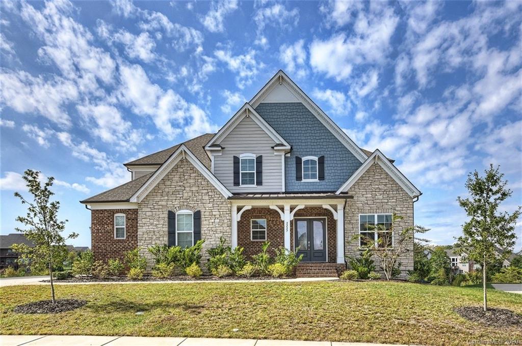2227 Watermark Point Place Fort Mill, SC 29708 - Photo 1 of 43 a front view of a house with garden