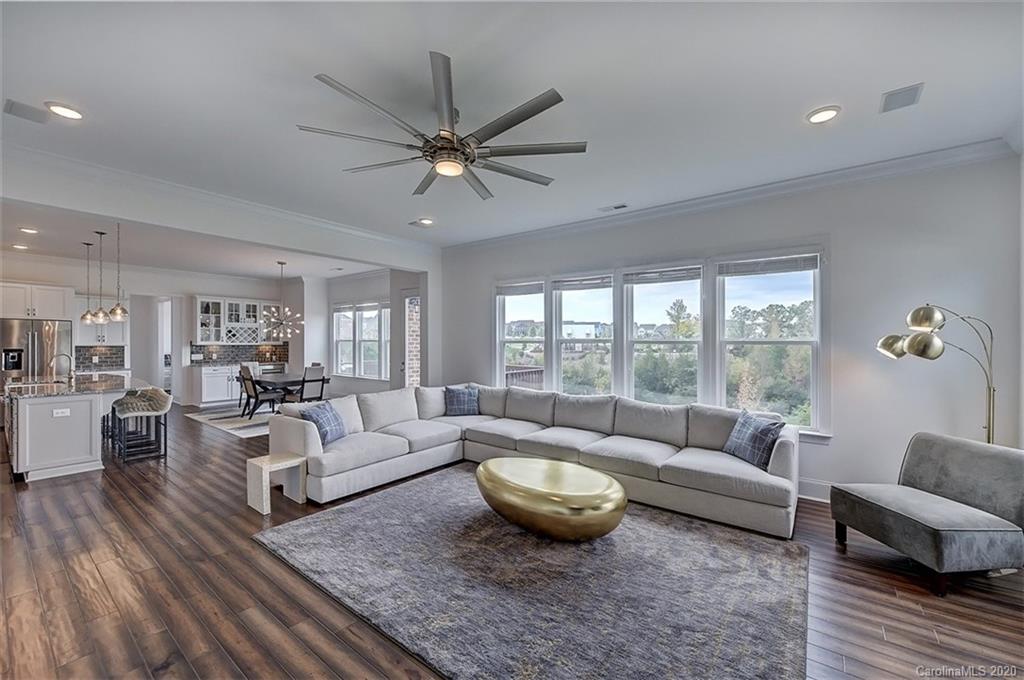 2227 Watermark Point Place Fort Mill, SC 29708 - Photo 11 of 43 a living room with furniture and a large window