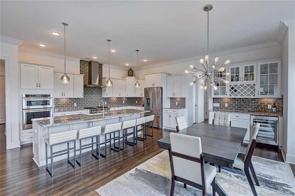 2227 Watermark Point Place Fort Mill, SC 29708 - Photo 14 of 43 a large kitchen with a table and chairs