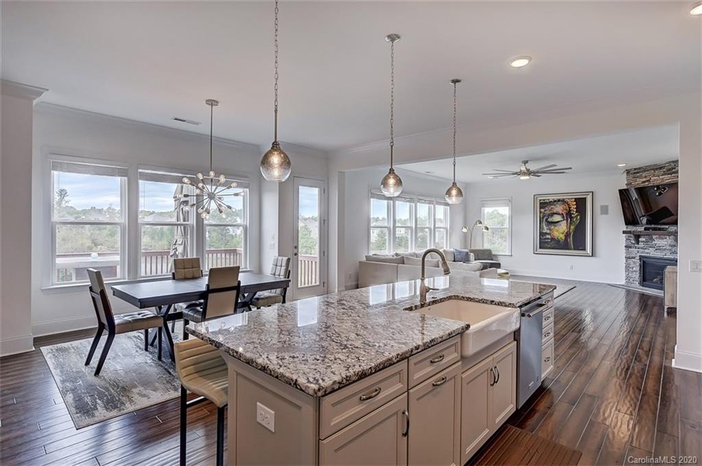 2227 Watermark Point Place Fort Mill, SC 29708 - Photo 18 of 43 a dining table with chairs and wooden floor