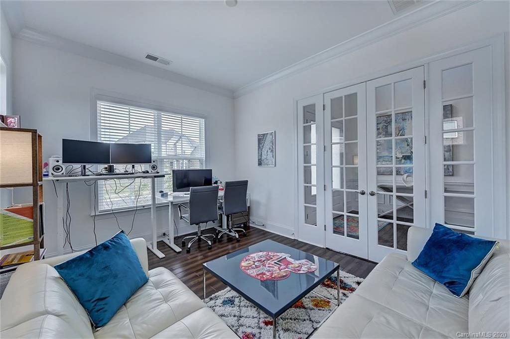 2227 Watermark Point Place Fort Mill, SC 29708 - Photo 20 of 43 a living room with furniture and a flat screen tv