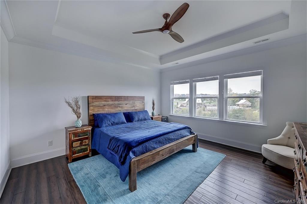 2227 Watermark Point Place Fort Mill, SC 29708 - Photo 23 of 43 a bedroom with a bed and a window