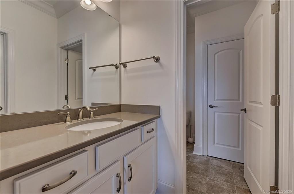 2227 Watermark Point Place Fort Mill, SC 29708 - Photo 30 of 43 a bathroom with a granite countertop sink and a mirror