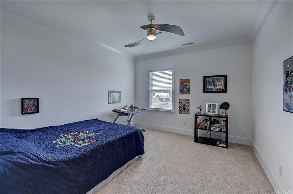 2227 Watermark Point Place Fort Mill, SC 29708 - Photo 31 of 43 a bedroom with a bed furniture and a window