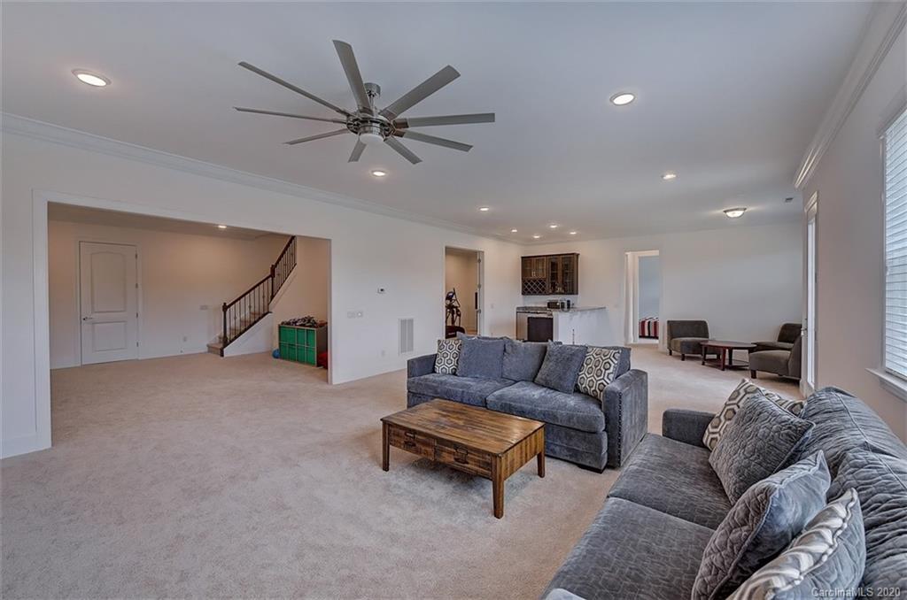 2227 Watermark Point Place Fort Mill, SC 29708 - Photo 33 of 43 a living room with furniture and a ceiling fan