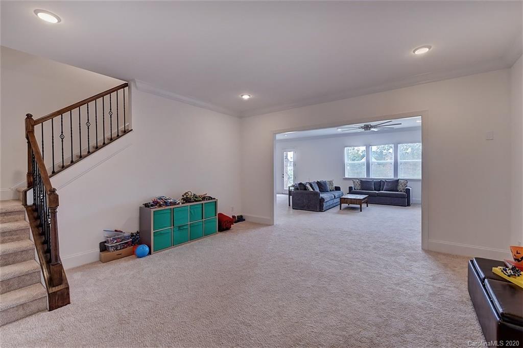 2227 Watermark Point Place Fort Mill, SC 29708 - Photo 37 of 43 a living room with furniture and a window