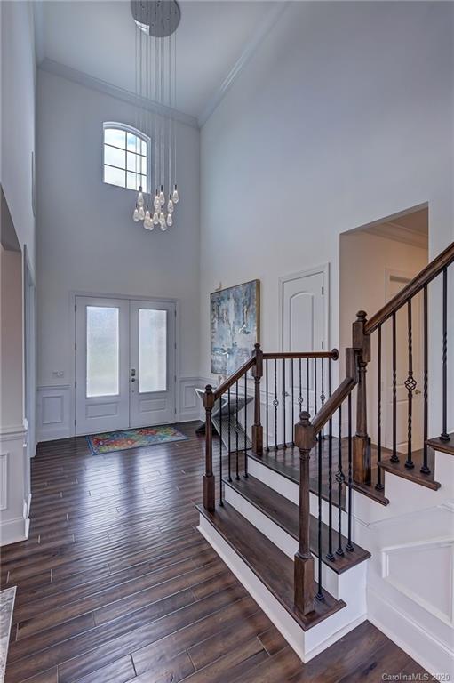 2227 Watermark Point Place Fort Mill, SC 29708 - Photo 5 of 43 a view of staircase with wooden floor and window