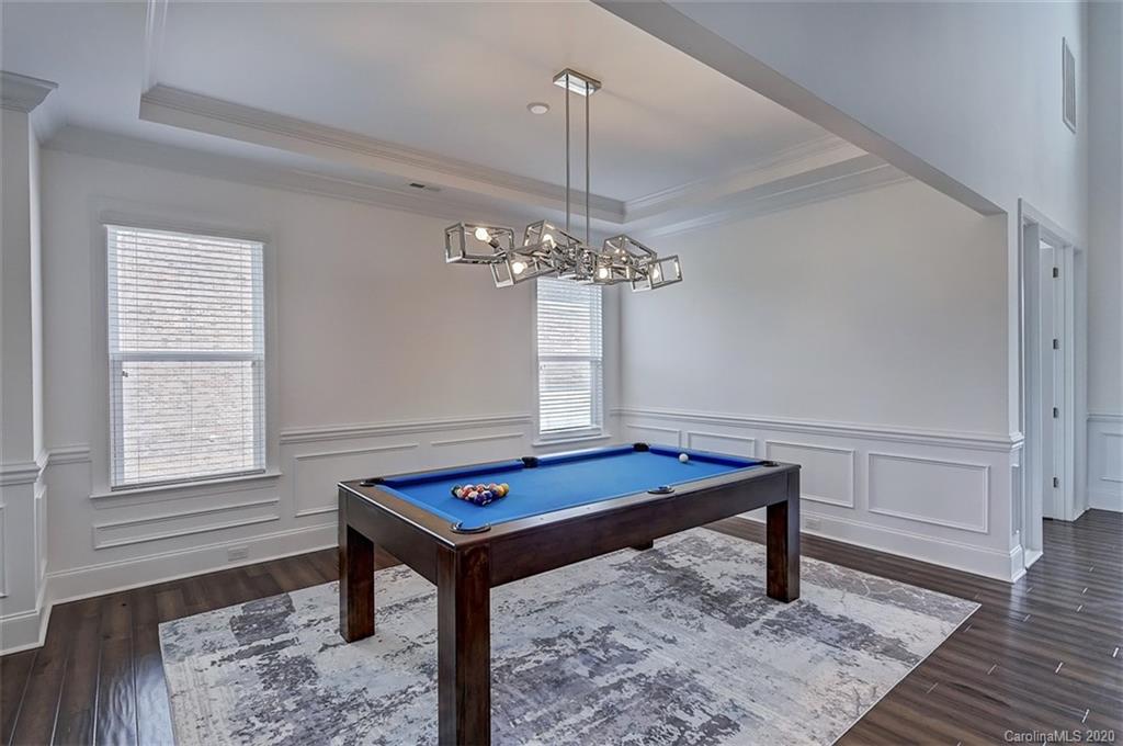 2227 Watermark Point Place Fort Mill, SC 29708 - Photo 6 of 43 a room with chandelier table and windows
