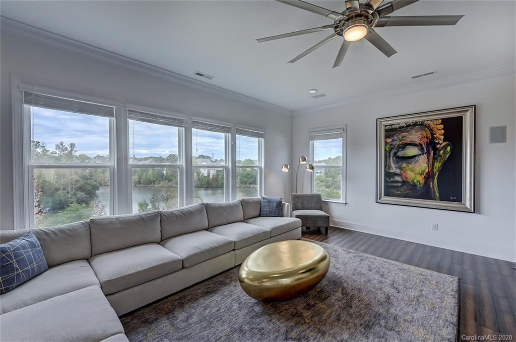 2227 Watermark Point Place Fort Mill, SC 29708 - Photo 9 of 43 a living room with furniture and a large window