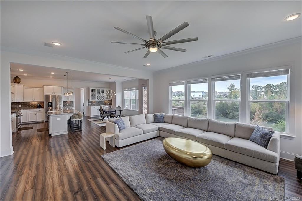 2227 Watermark Point Place Fort Mill, SC 29708 - Photo 10 of 43 a living room with furniture and a large window