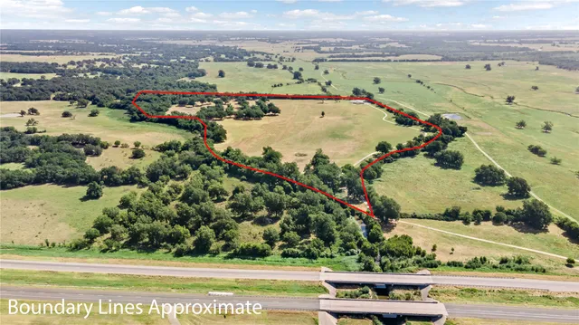 an aerial view of a residential houses with outdoor space