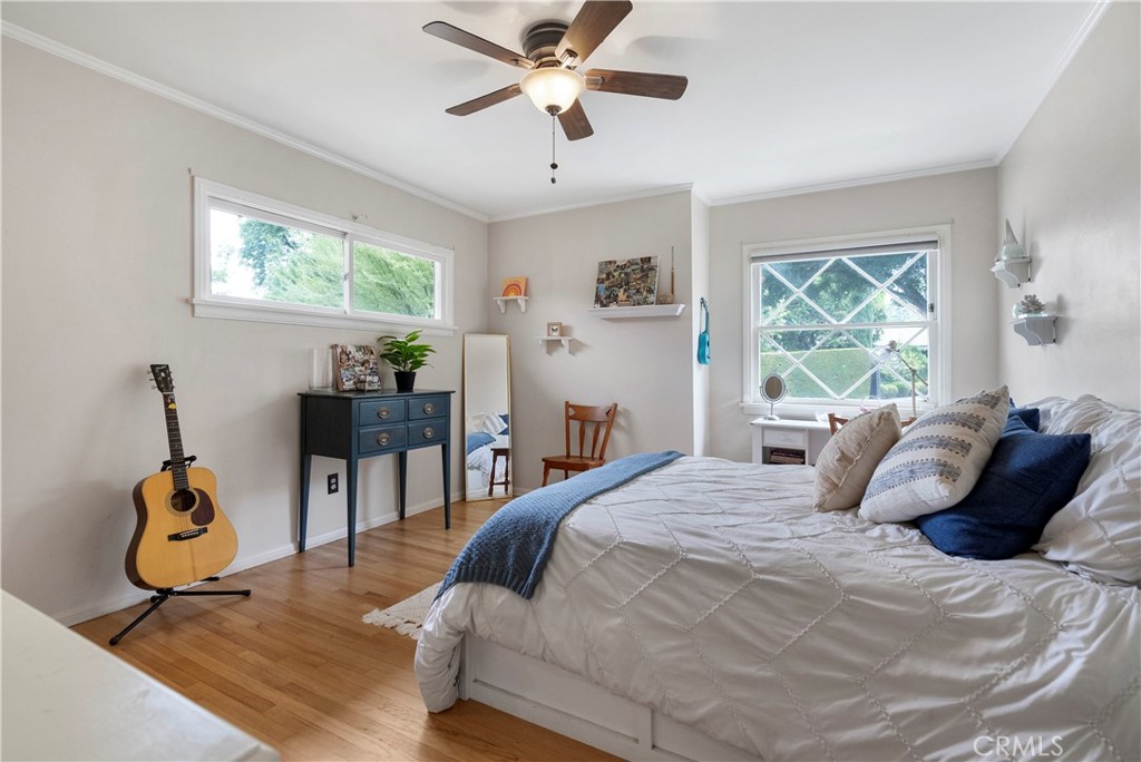 5407 Telefair Way Riverside, CA 92506 - Photo 14 of 35 a bedroom with a bed and wooden floor