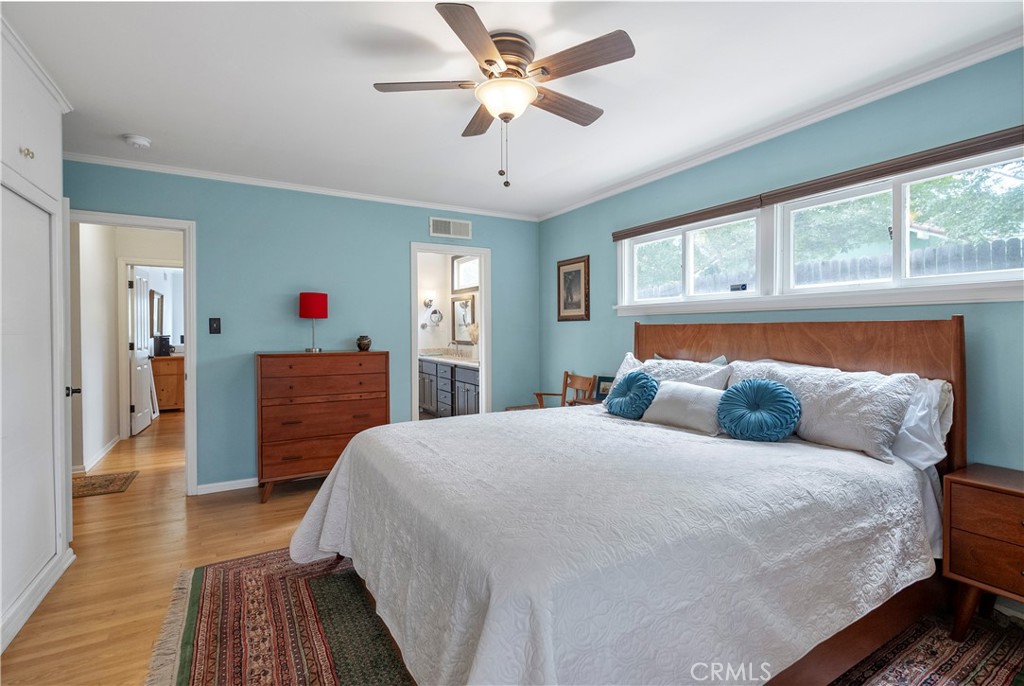 5407 Telefair Way Riverside, CA 92506 - Photo 18 of 35 a bedroom with a bed and a chandelier