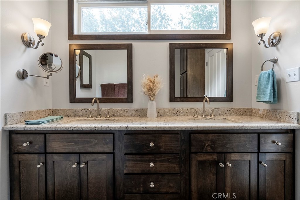 5407 Telefair Way Riverside, CA 92506 - Photo 19 of 35 a bathroom with a granite countertop sink and a mirror