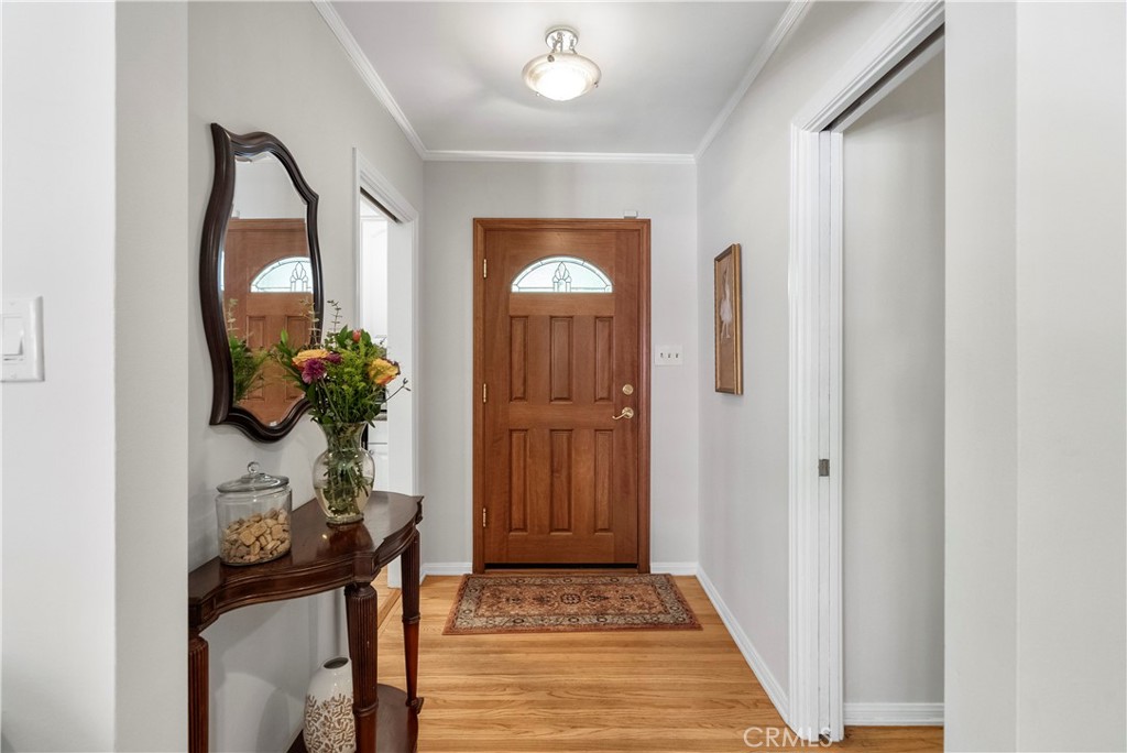 5407 Telefair Way Riverside, CA 92506 - Photo 2 of 35 a view of a hallway to a livingroom and a potted plant