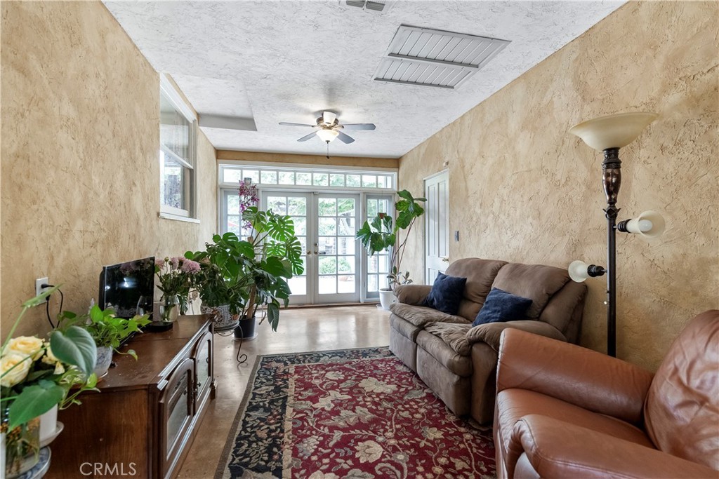 5407 Telefair Way Riverside, CA 92506 - Photo 25 of 35 a living room with furniture and a potted plant