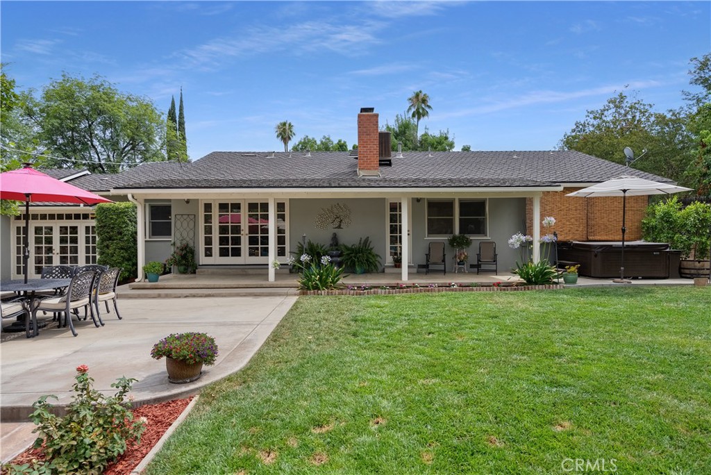 5407 Telefair Way Riverside, CA 92506 - Photo 31 of 35 a view of a house with backyard sitting area and garden