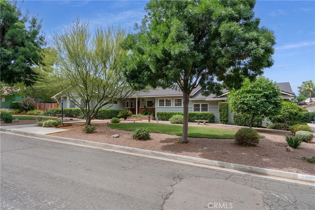 5407 Telefair Way Riverside, CA 92506 - Photo 35 of 35 a front view of a house with a garden and trees