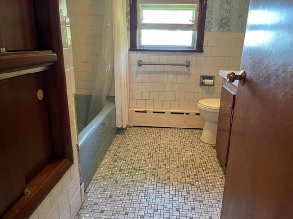 271 Bailey Street Fall River, MA 02724 - Photo 5 of 10 a bathroom with a granite countertop shower and a toilet