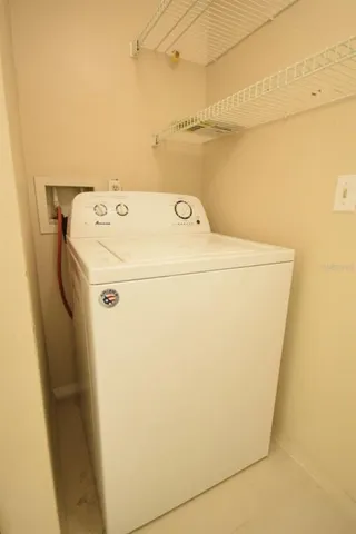 a bedroom with a bed and a ceiling fan