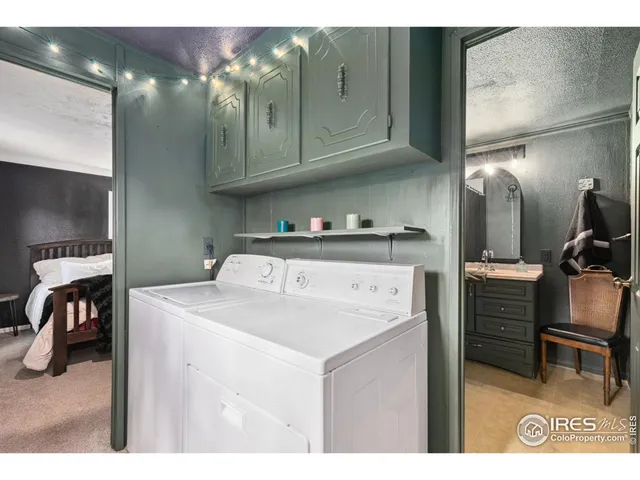 a utility room with closet dryer and washer