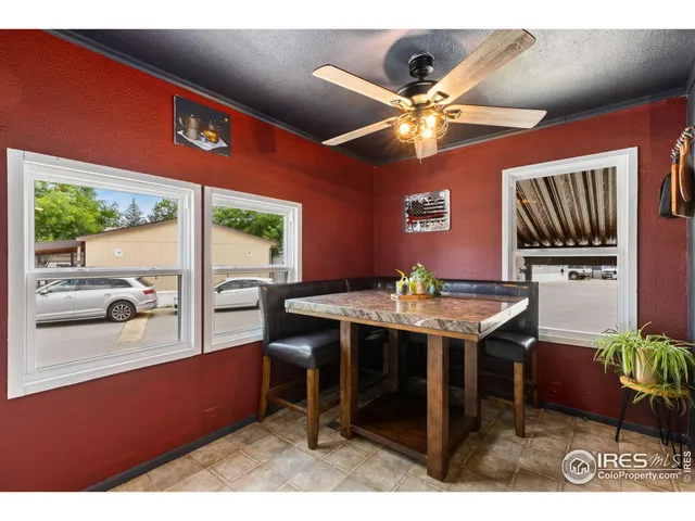 a dinning table and chairs in a room