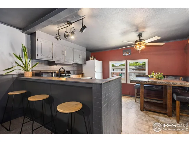 a kitchen with cabinets and appliances