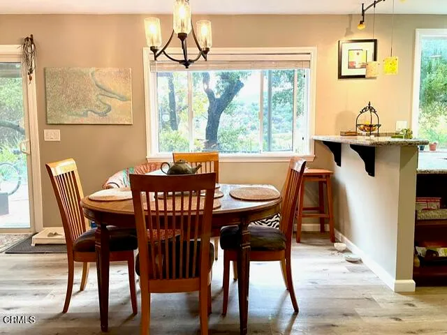 a view of a dining room with furniture window and outside view