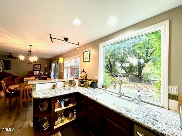 a kitchen with a sink and a large window