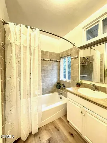 a bathroom with a bathtub and a sink
