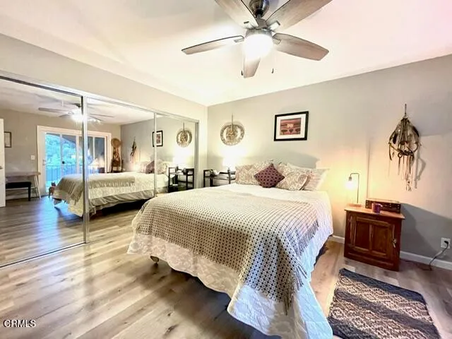 a bedroom with double bed and a chandelier