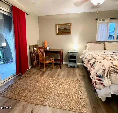 a bedroom with a bed and a table in it