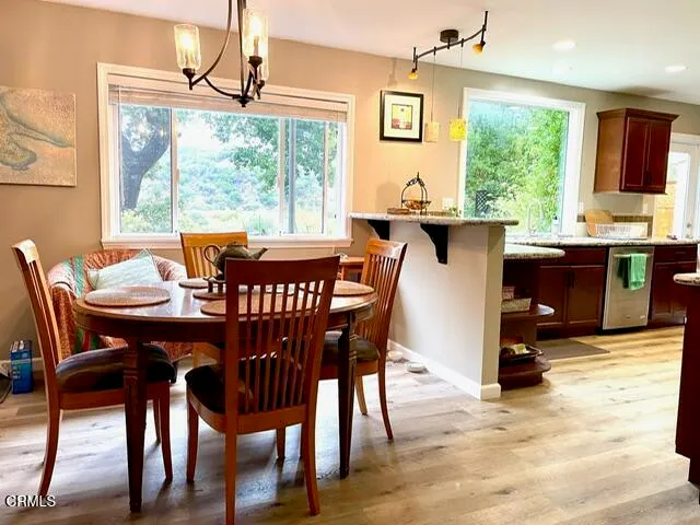 a dining room with furniture window wooden floor