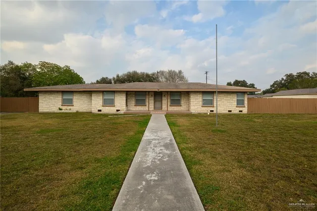 a front view of a house with yard